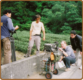 Photo of reviewing footage on location in Taiwan